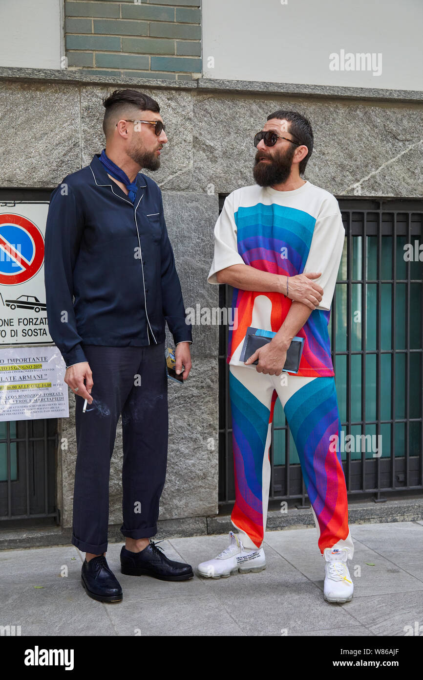 MILAN, ITALY - JUNE 15, 2019: Men with blue jacket and trousers and  colorful geometric suit before Emporio Armani fashion show, Milan Fashion  Week str Stock Photo - Alamy