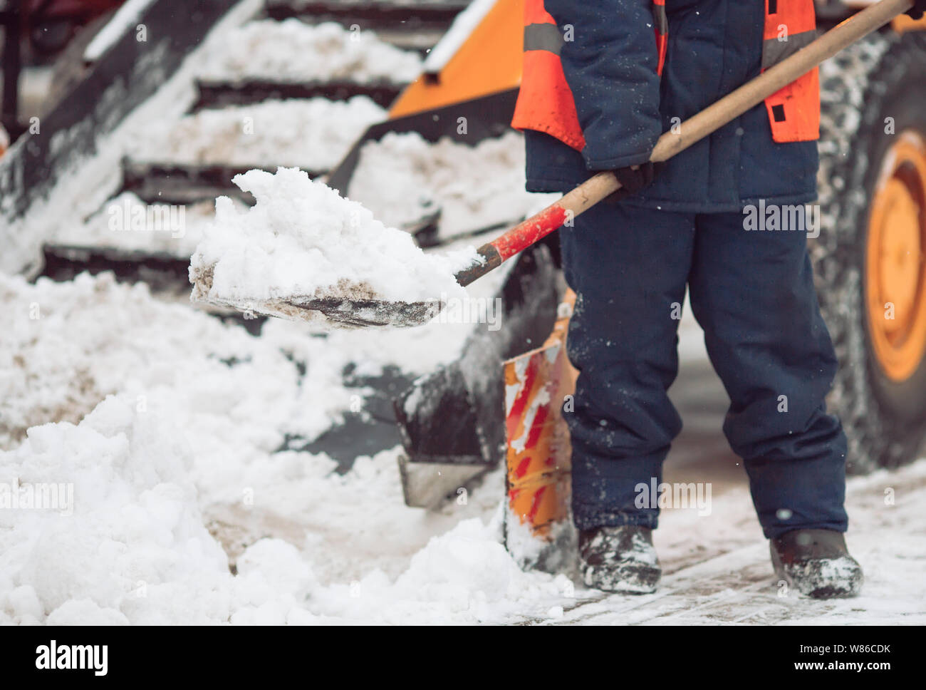 Workers shovel snow in city hi-res stock photography and images - Alamy