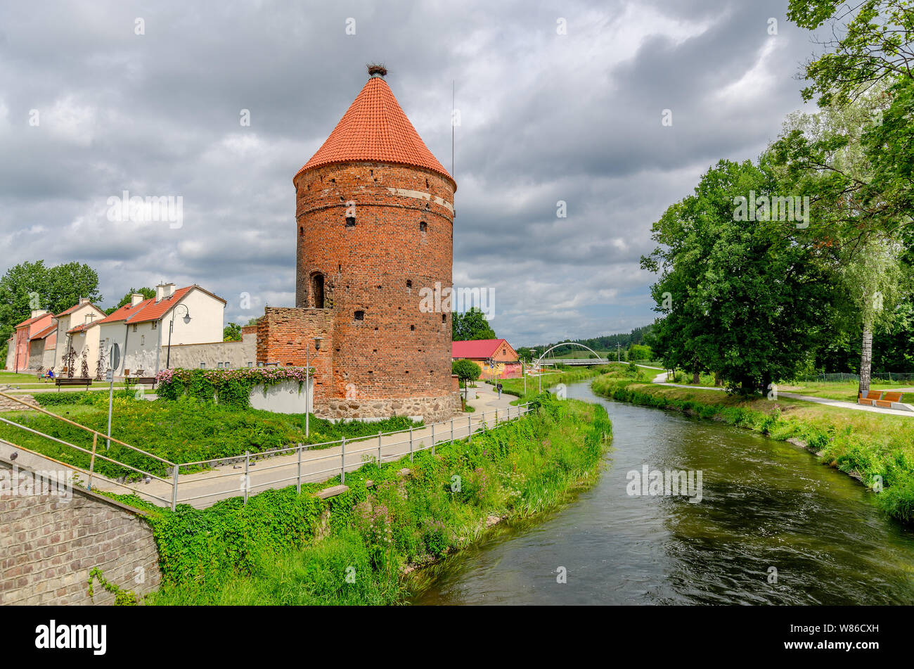 Dobre Miasto, ger. Guttstadt, warmian-mazurian province, Poland. The Stork Tower, remains of the medieval city walls by the river of Lyna (Alle). Stock Photo