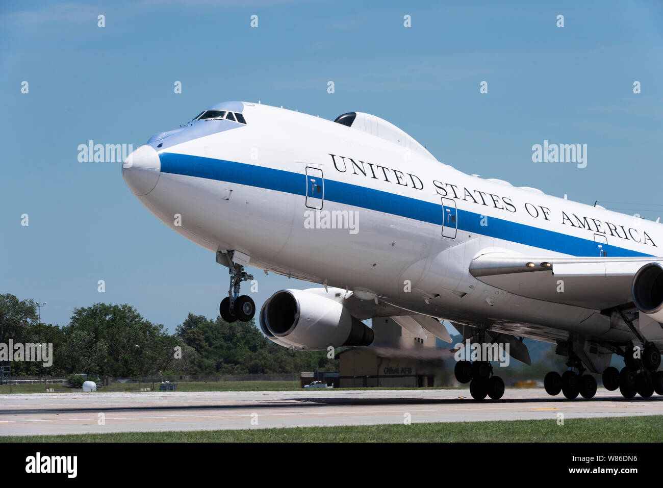 A U.S. Air Force E-4B National Airborne Operations Center aircraft takes off from Offutt Air Force Base, Nebraska, July 10, 2019. The main deck is divided into six functional areas: a command work area, a conference room, a briefing room, an operations team work area, a communications area and a rest area. (U.S. Air Force photo by Staff Sgt. Jacob Skovo) Stock Photo