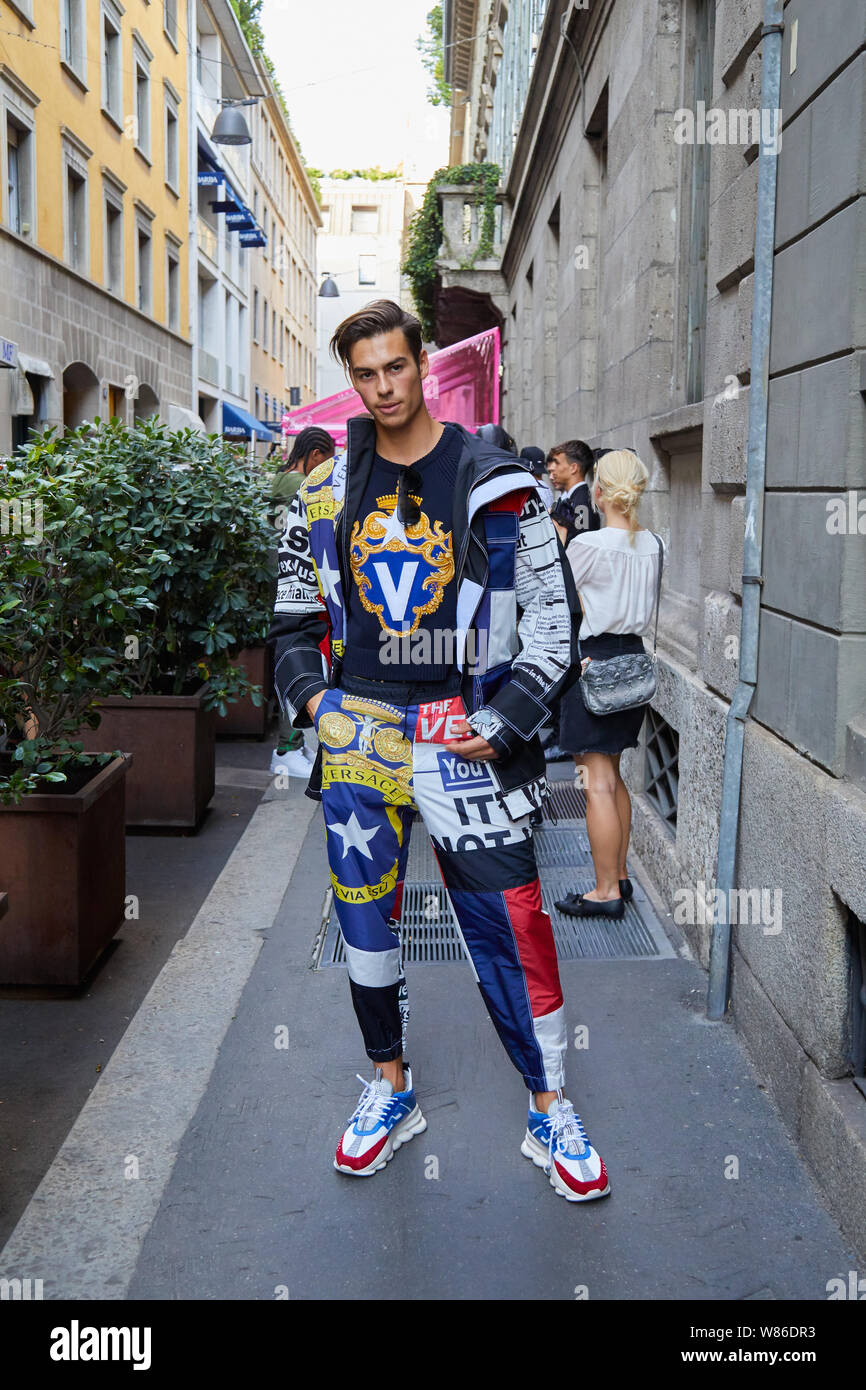 MILAN, ITALY - JUNE 15, 2019: Man with Versace outfit before Versace  fashion show, Milan Fashion Week street style Stock Photo - Alamy