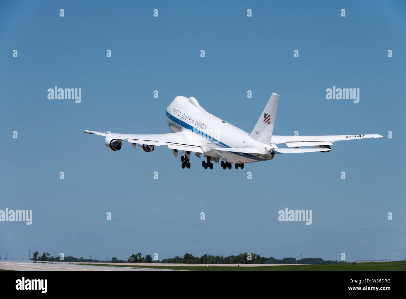 A U.S. Air Force E-4B National Airborne Operations Center aircraft takes off from Offutt Air Force Base, Nebraska, July 10, 2019. The E-4B is capable of seating more than 100 people including a joint-service team, an Air Force flight crew, maintenance and security components, a communications team and selected augmentees. (U.S. Air Force photo by Staff Sgt. Jacob Skovo) Stock Photo