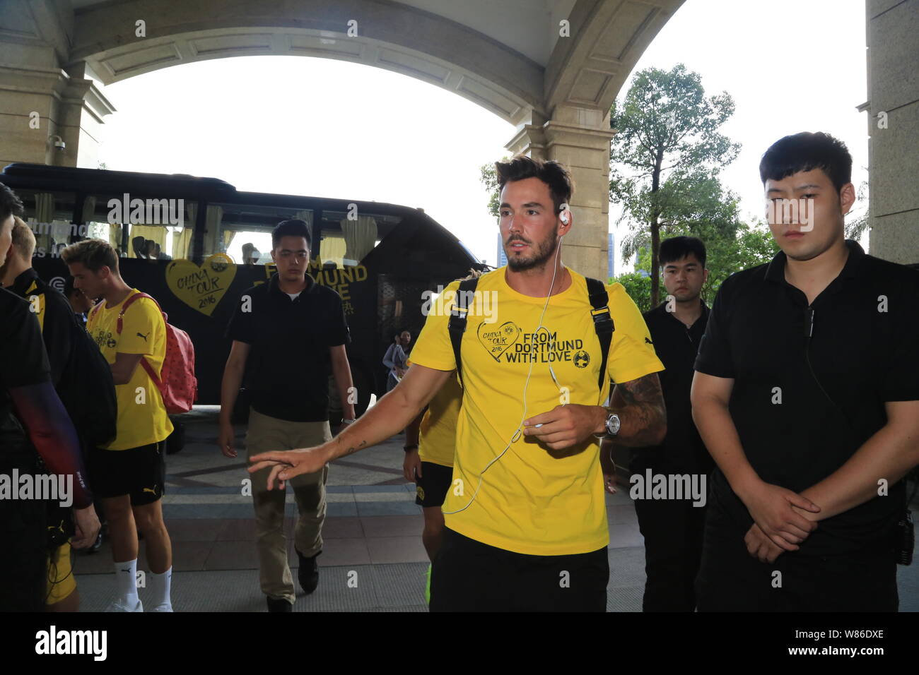 Roman Burki, center, and teammates of Borussia Dortmund arrive at the hotel in Shenzhen city, south China's Guangdong province, 27 July 2016. Stock Photo