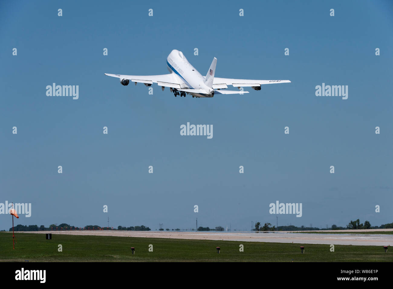 A U.S. Air Force E-4B National Airborne Operations Center aircraft takes off from Offutt Air Force Base, Nebraska, July 10, 2019. The E-4B is protected against the effects of an electromagnetic pulse and has an electrical system designed to support advanced electronics and a wide variety of communications equipment.(U.S. Air Force photo by Staff Sgt. Jacob Skovo) Stock Photo
