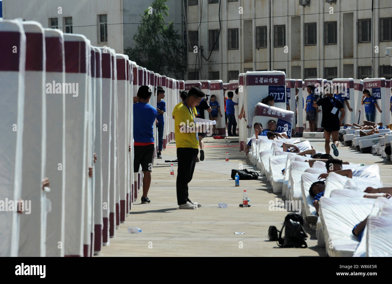 Participants tumble on their mattresses in an attempt to set a new