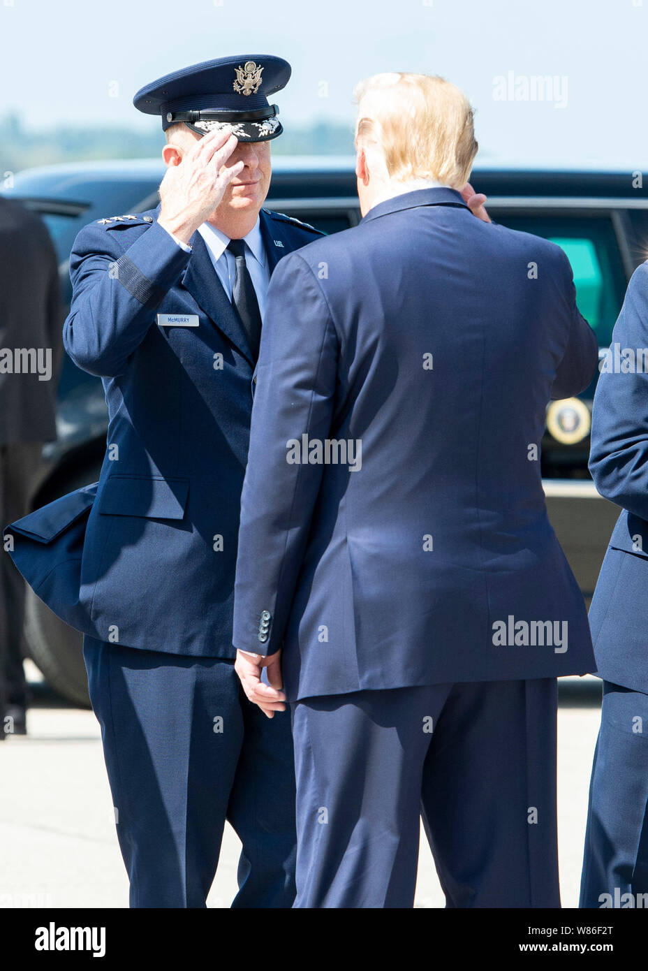 Lt. Gen. Robert McMurry, Jr., Air Force Life Cycle Management Center commander, salutes President Donald J. Trump as he departs Air Force One after landing at Wright-Patterson Air Force Base, Ohio, Aug. 7, 2019. President Trump landed at Wright-Patt to visit first responders and survivors in neighboring Dayton, Ohio, after the mass shooting on Aug. 4. (U.S. Air Force photo by Wesley Farnsworth) Stock Photo