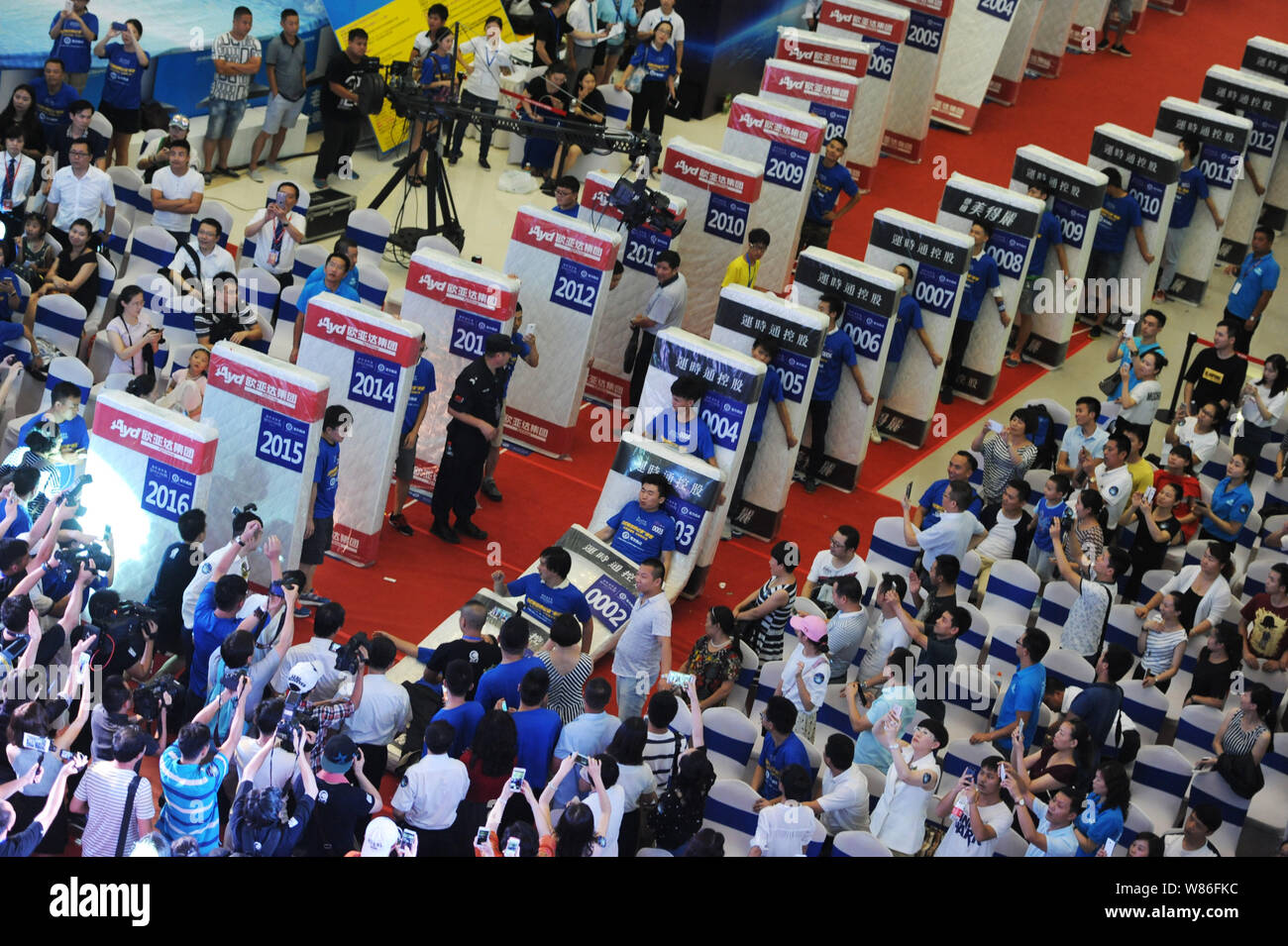 Participants tumble on their mattresses in an attempt to set a new