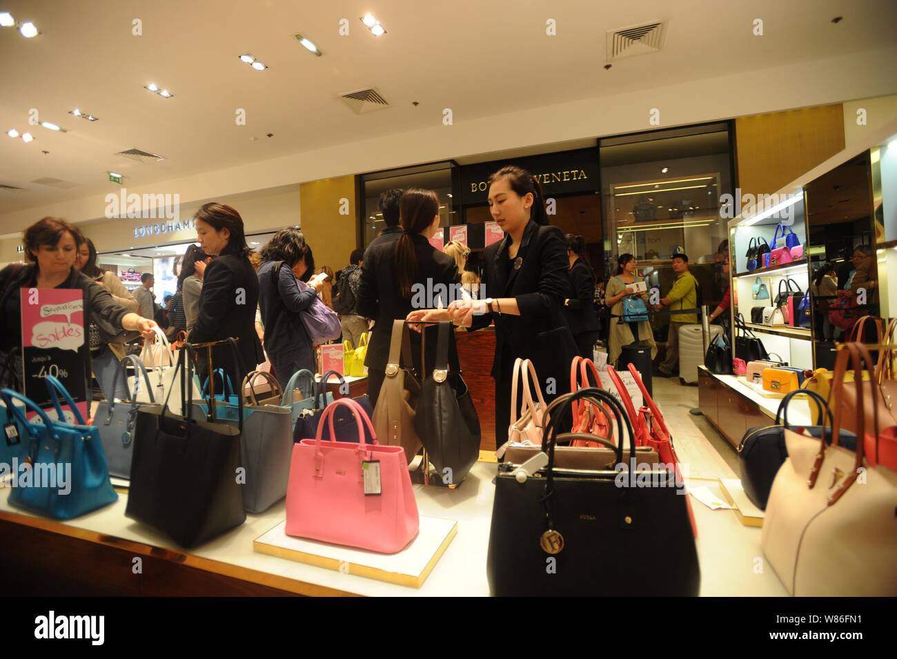Chinese customers shop for Furla handbags at the Galeries Lafayette  department store during the 2016 "Les Soldes" Summer Sales in Paris,  France, 1 Jul Stock Photo - Alamy