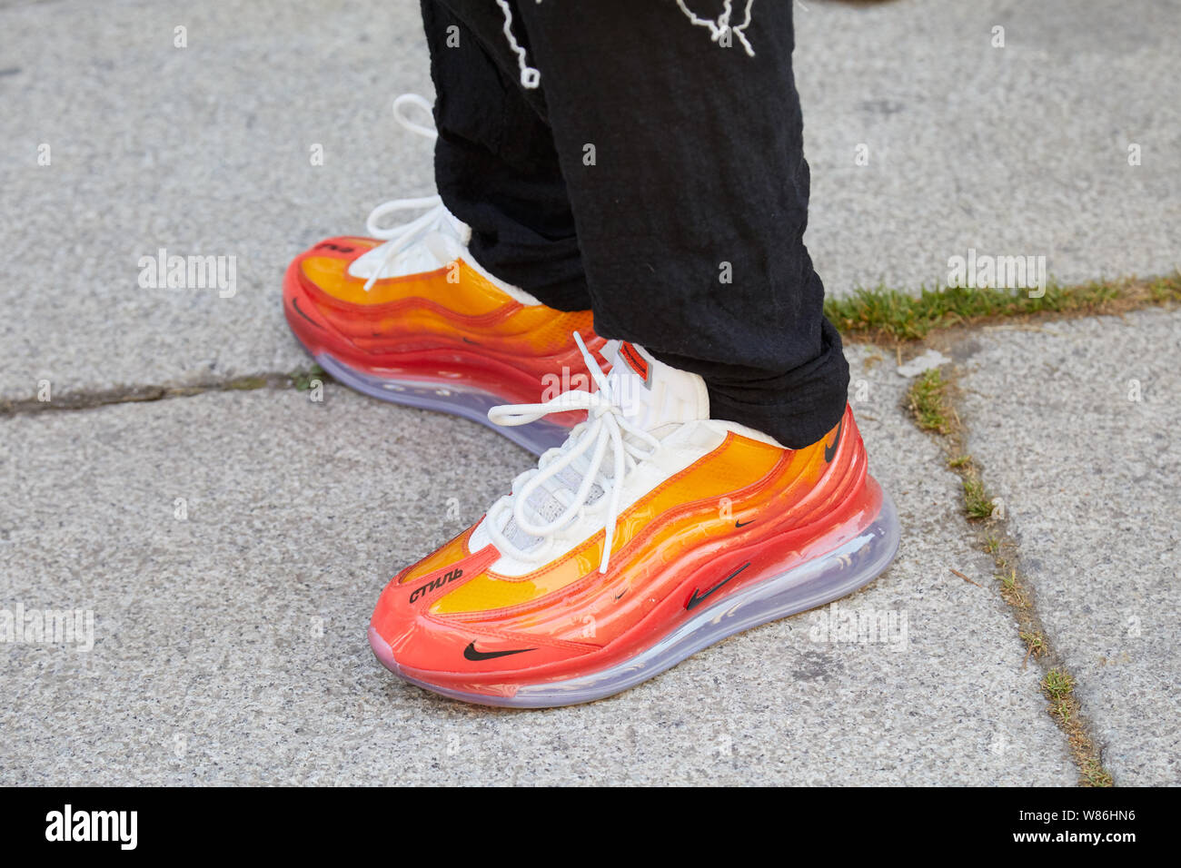 MILAN, ITALY - JUNE 16, 2019: Man with orange Nike sneakers with  transparent sole before Les Hommes fashion show, Milan Fashion Week street  style Stock Photo - Alamy