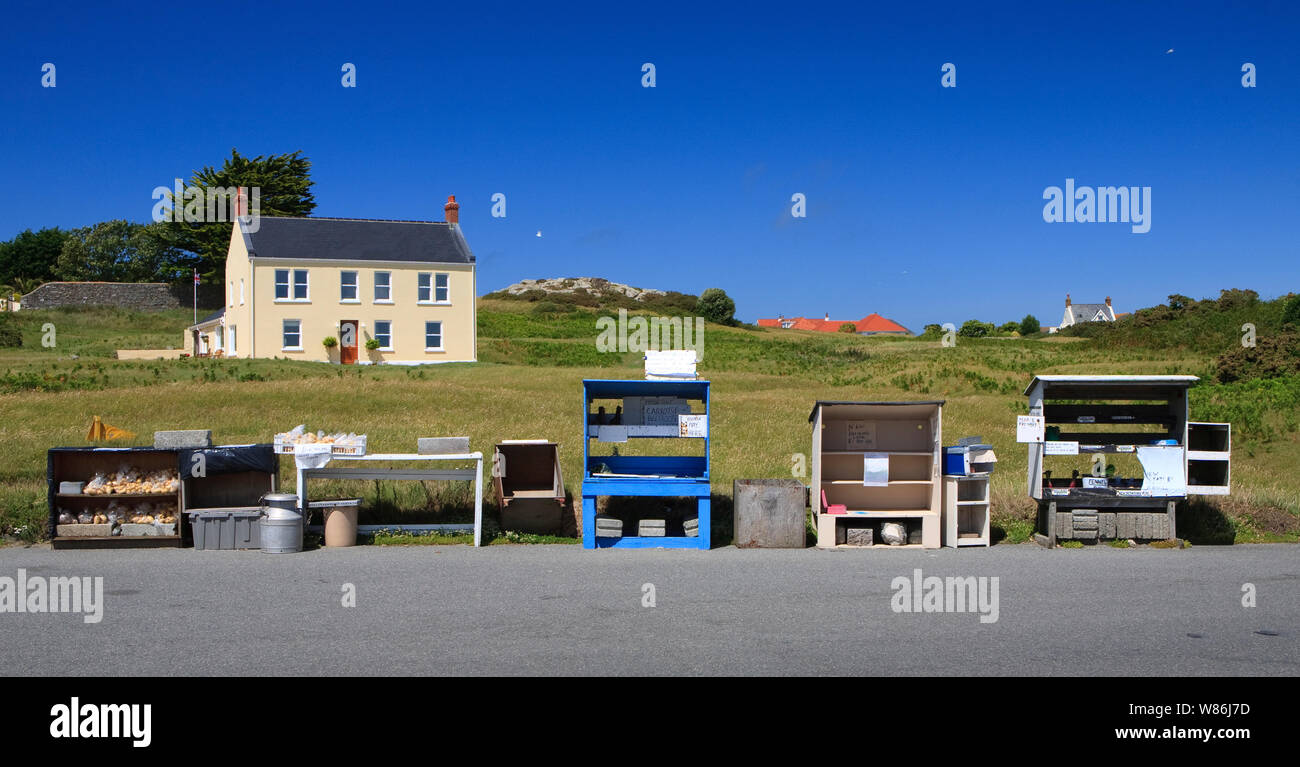 locally grown fruit and vegetables in Guernsey being sold from 'honesty box' stalls at the side of the road Stock Photo