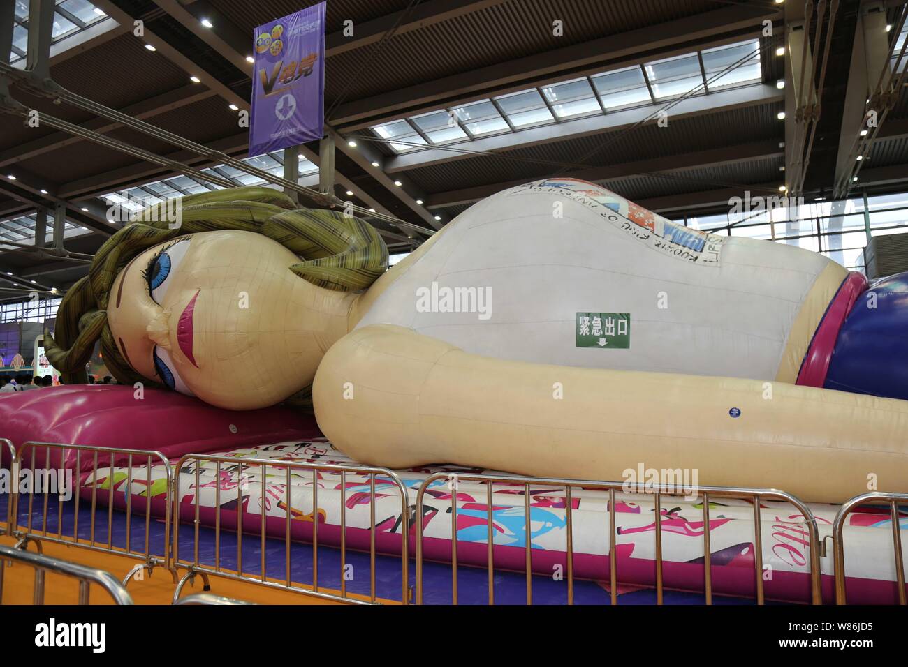 A giant inflatable doll is on display during the 2016 Shenzhen Cartoon and Animation Festival in Shenzhen city, south China's Guangdong province, 21 J Stock Photo