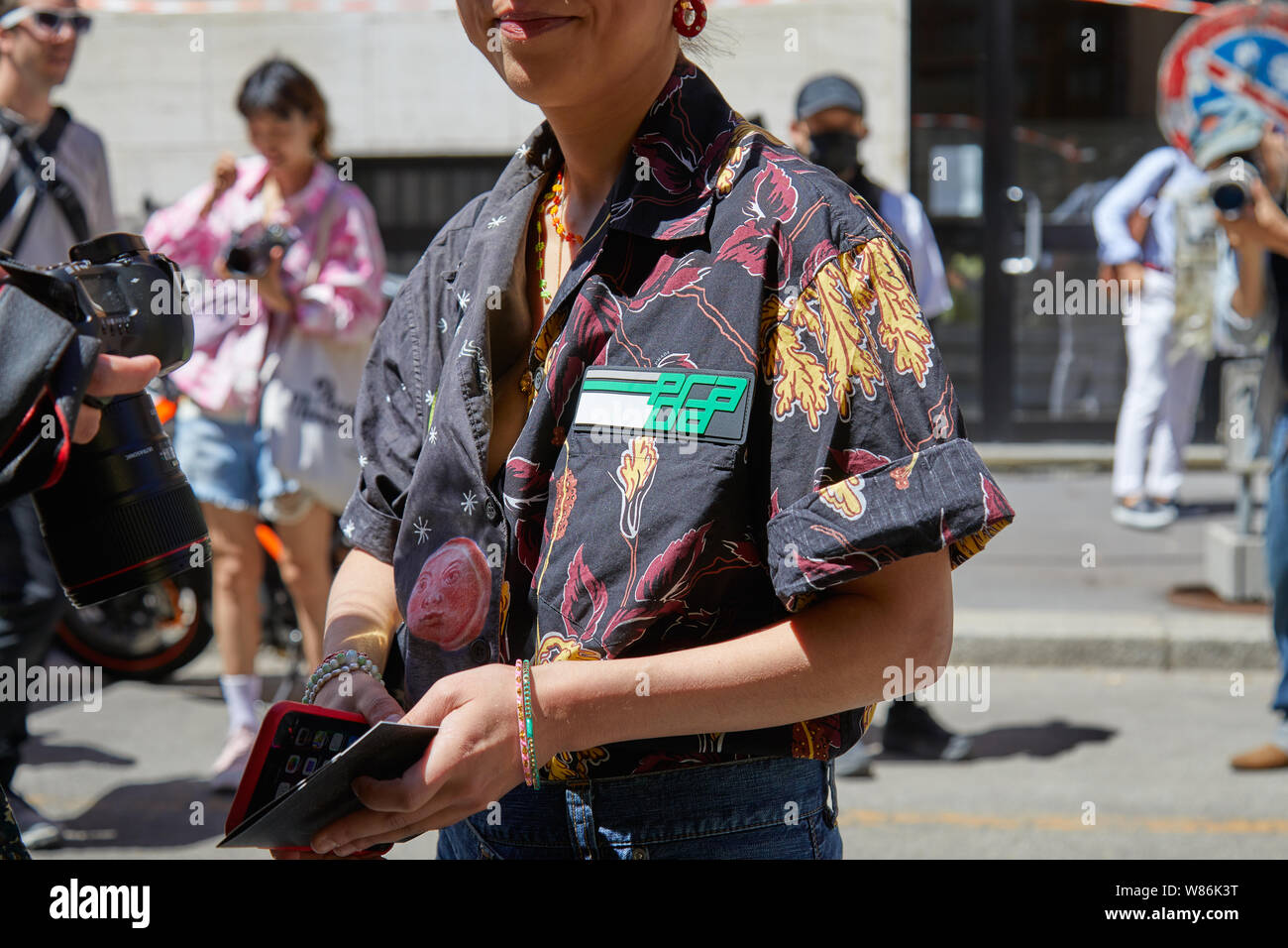 MILAN, ITALY - JUNE 16, 2019: Woman with black Prada shirt with floral  design before Etro fashion show, Milan Fashion Week street style Stock  Photo - Alamy