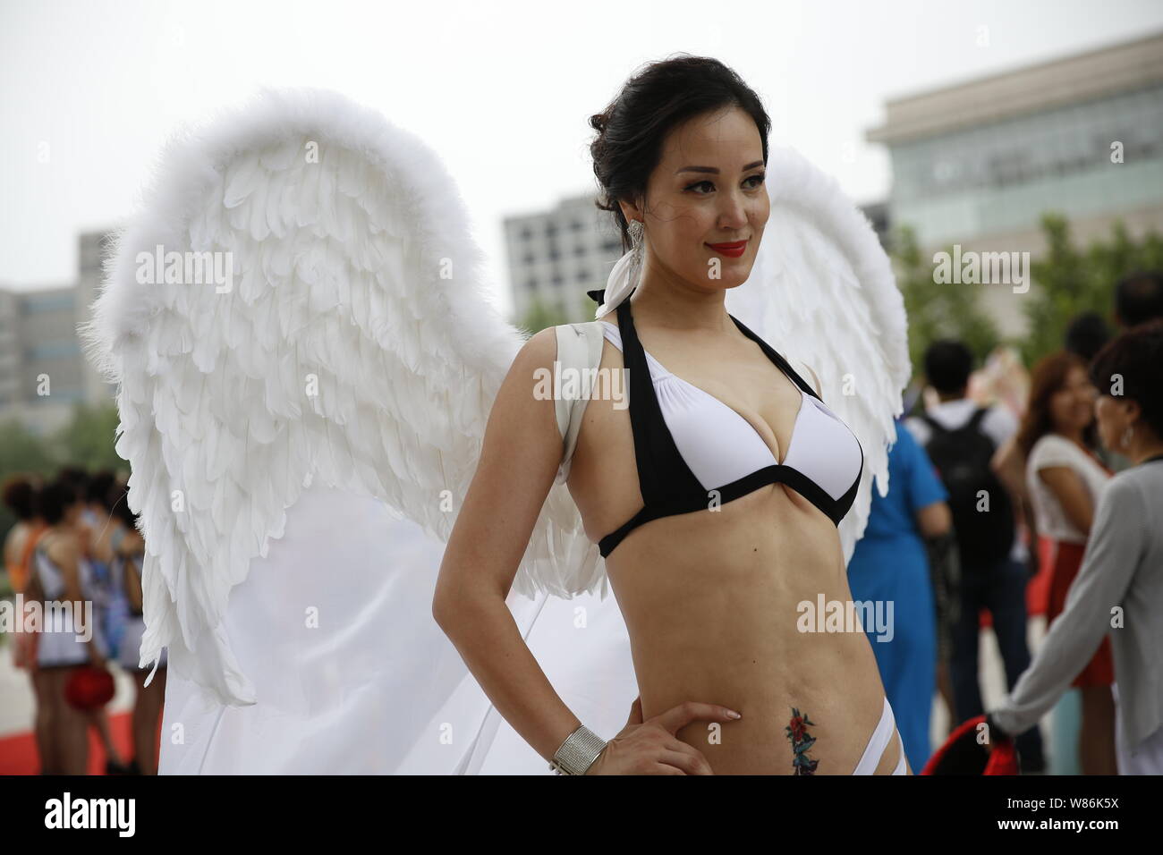 A middle-aged Chinese woman dressed in bikini poses during a middle-aged  and elderly bikini contest in Tianjin, China, 23 July 2016. Over the weeken  Stock Photo - Alamy