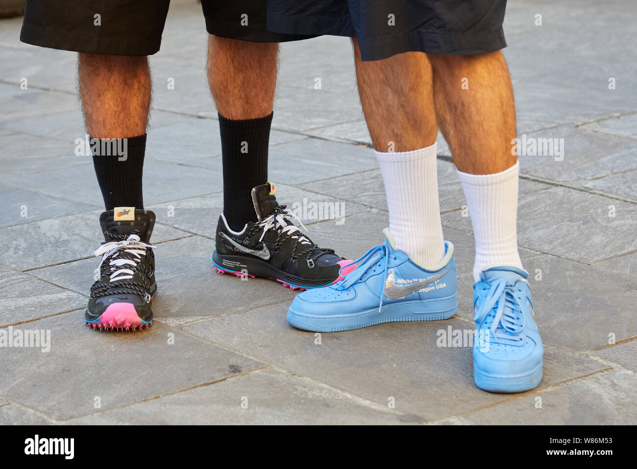 MILAN, ITALY - JUNE 16, 2019: Men with black and blue Nike sneakers before  Palm Angels fashion show, Milan Fashion Week street style Stock Photo -  Alamy