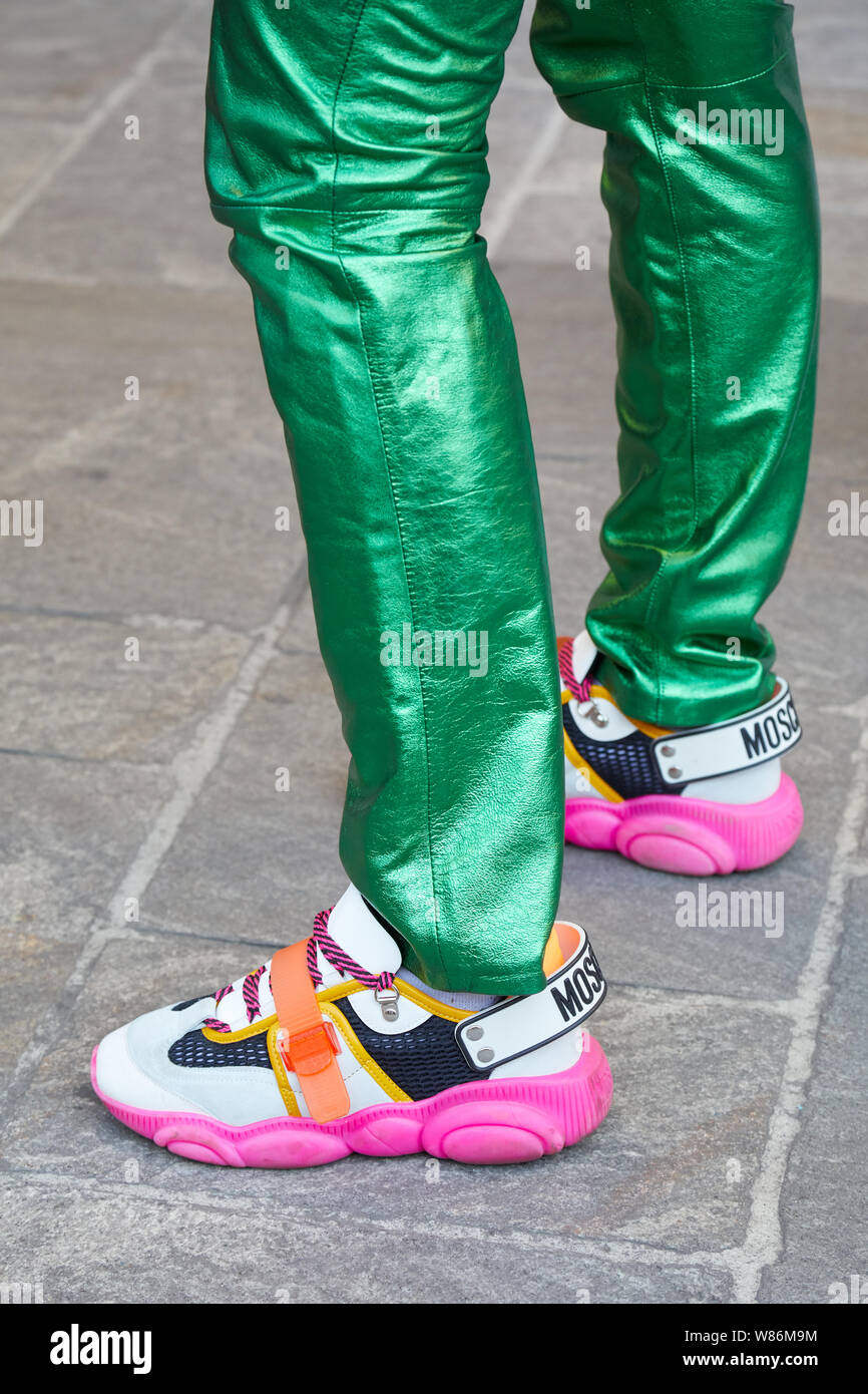 MILAN, ITALY - JUNE 16, 2019: Man with green metallic trousers and Moschino  sneakers before Palm Angels fashion show, Milan Fashion Week street style  Stock Photo - Alamy