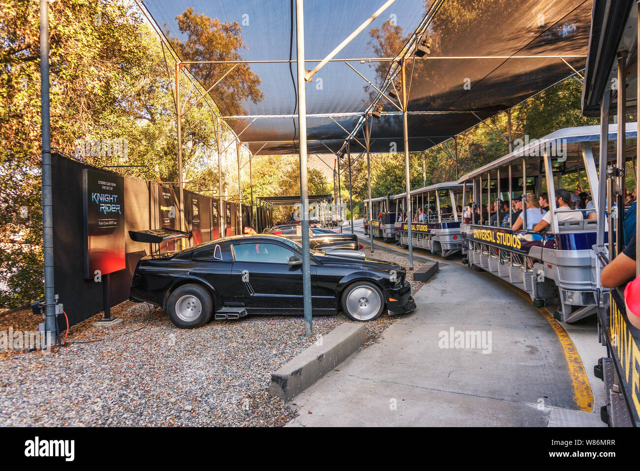 Studio Tour Tram with tourists driving through Universal Studios Hollywood Stock Photo