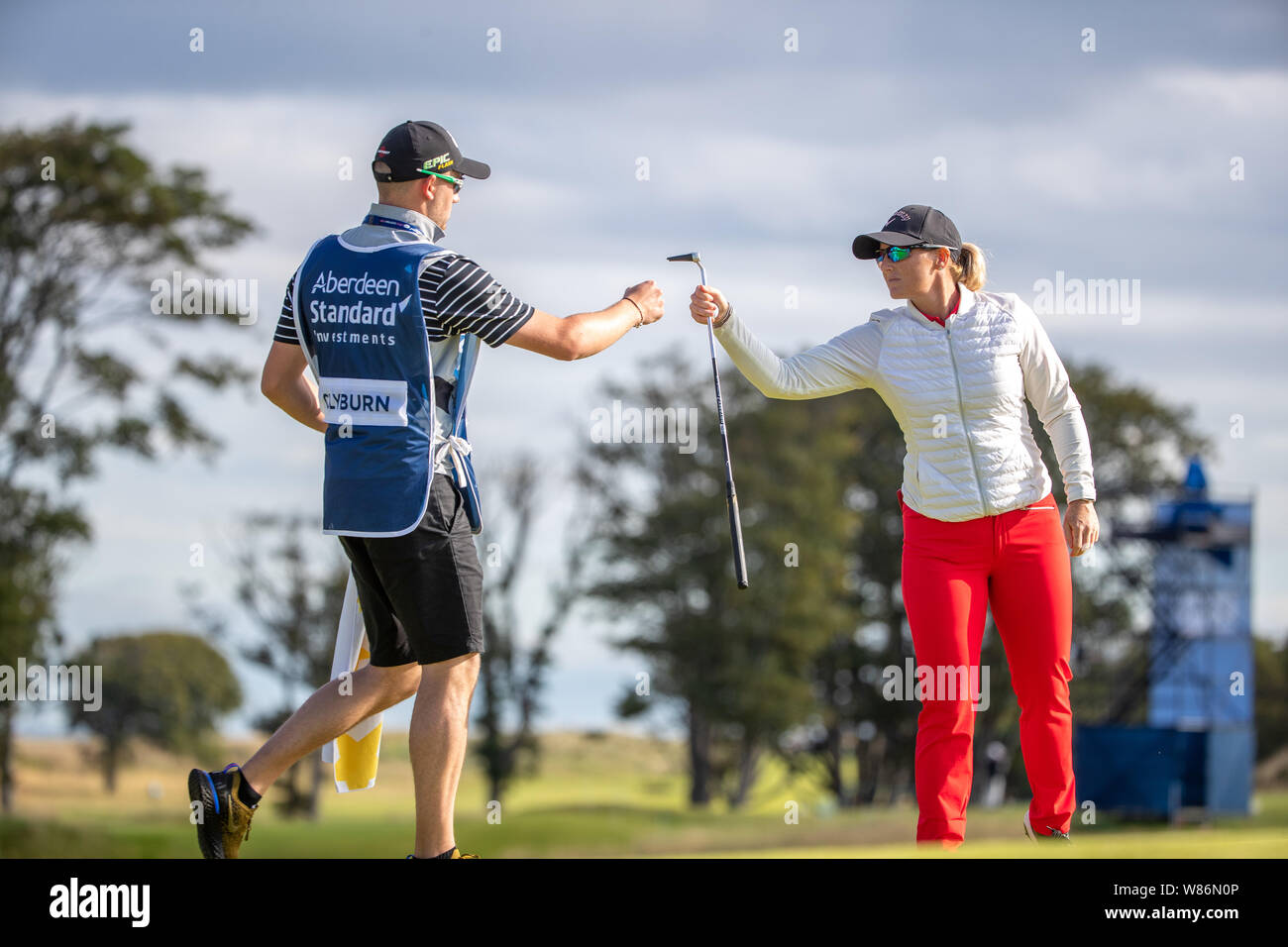 England's Holly Clyburn shares a little fist pump with her caddy following her birdie putt on the 9th green during day one of the Aberdeen Standard Investments Ladies Scottish Open at The Renaissance Club, North Berwick. Stock Photo