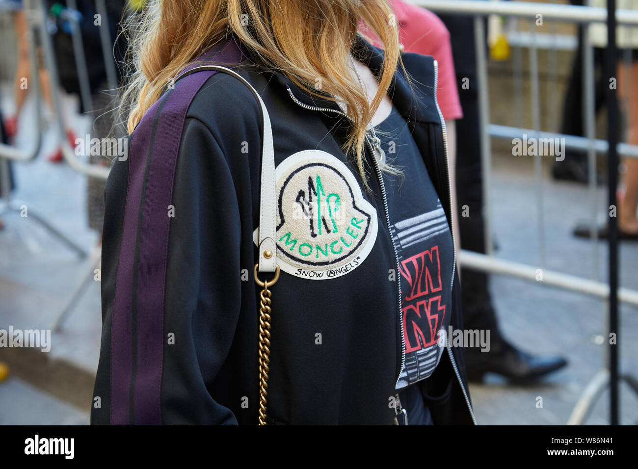 MILAN, ITALY - JUNE 16, 2019: Woman with Moncler jacket before Palm Angels  fashion show, Milan Fashion Week street style Stock Photo - Alamy