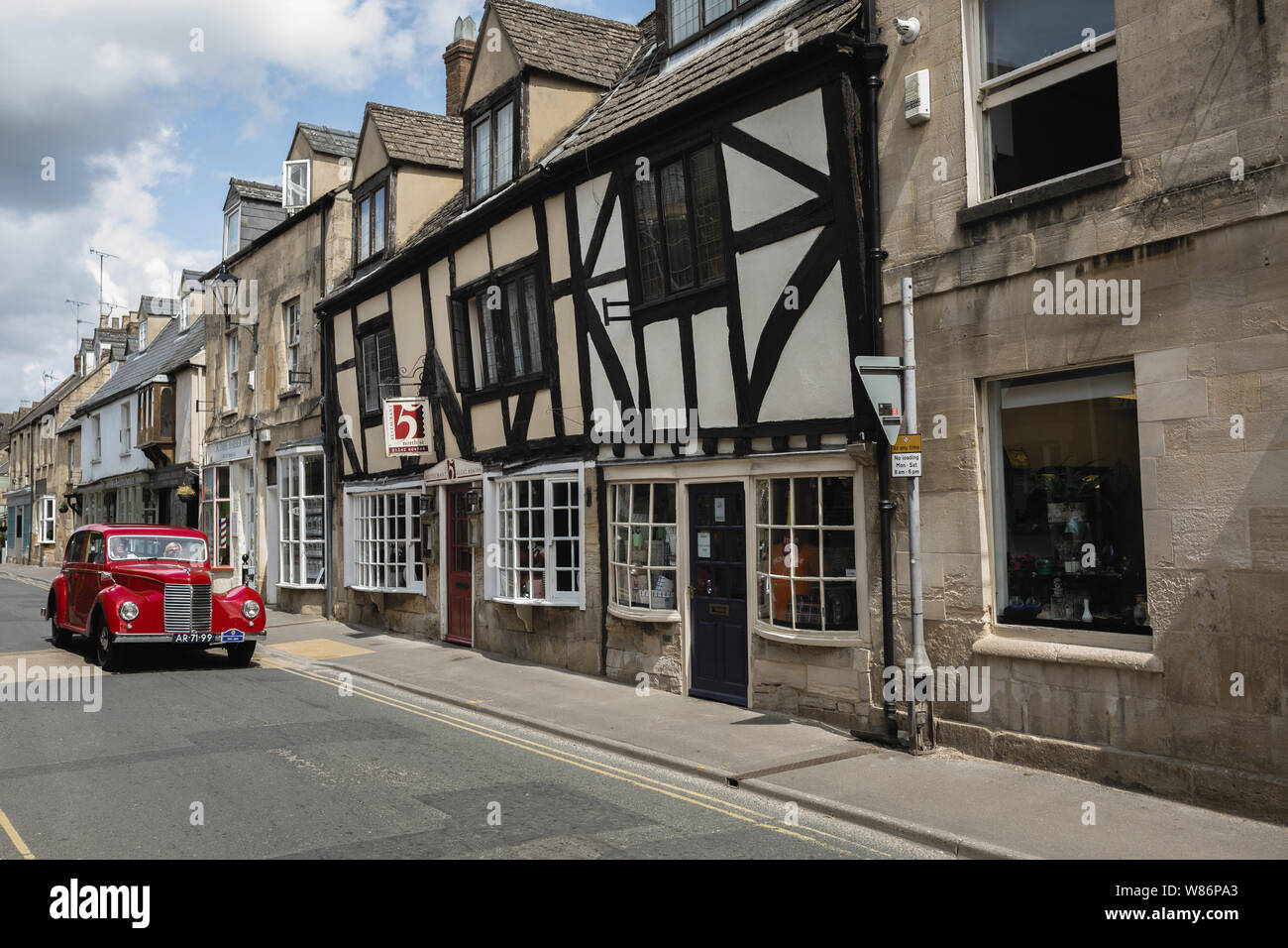 Vintage car, Shops and local businesses. Cotswold street scene. Winchcombe, Gloucestershire Stock Photo