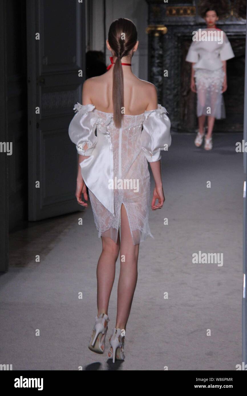 A model displays a new creation by Chinese designer Lan Yu in a fashion show during the Paris Haute Couture Fashion Week Fall/Winter 2016 in Paris, Fr Stock Photo