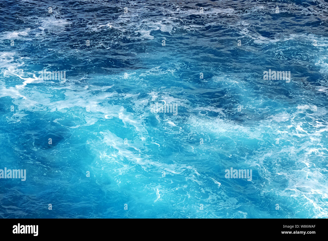 Shot of sea of ocean surface with moving water making foam Stock ...
