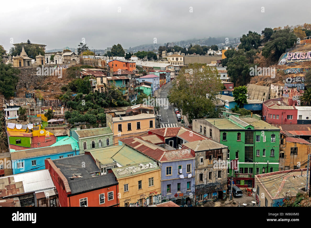 Poor suburb of Valparaiso with roofs and colorful houses located on the hillslopes, colourful architecture of Valparaiso is UNESCO heritage, Chile Stock Photo