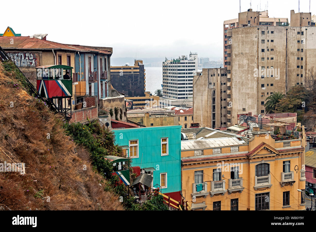 Poor suburb of Valparaiso with roofs and colorful houses located on the hillslopes, colourful architecture of Valparaiso is UNESCO heritage, Chile Stock Photo
