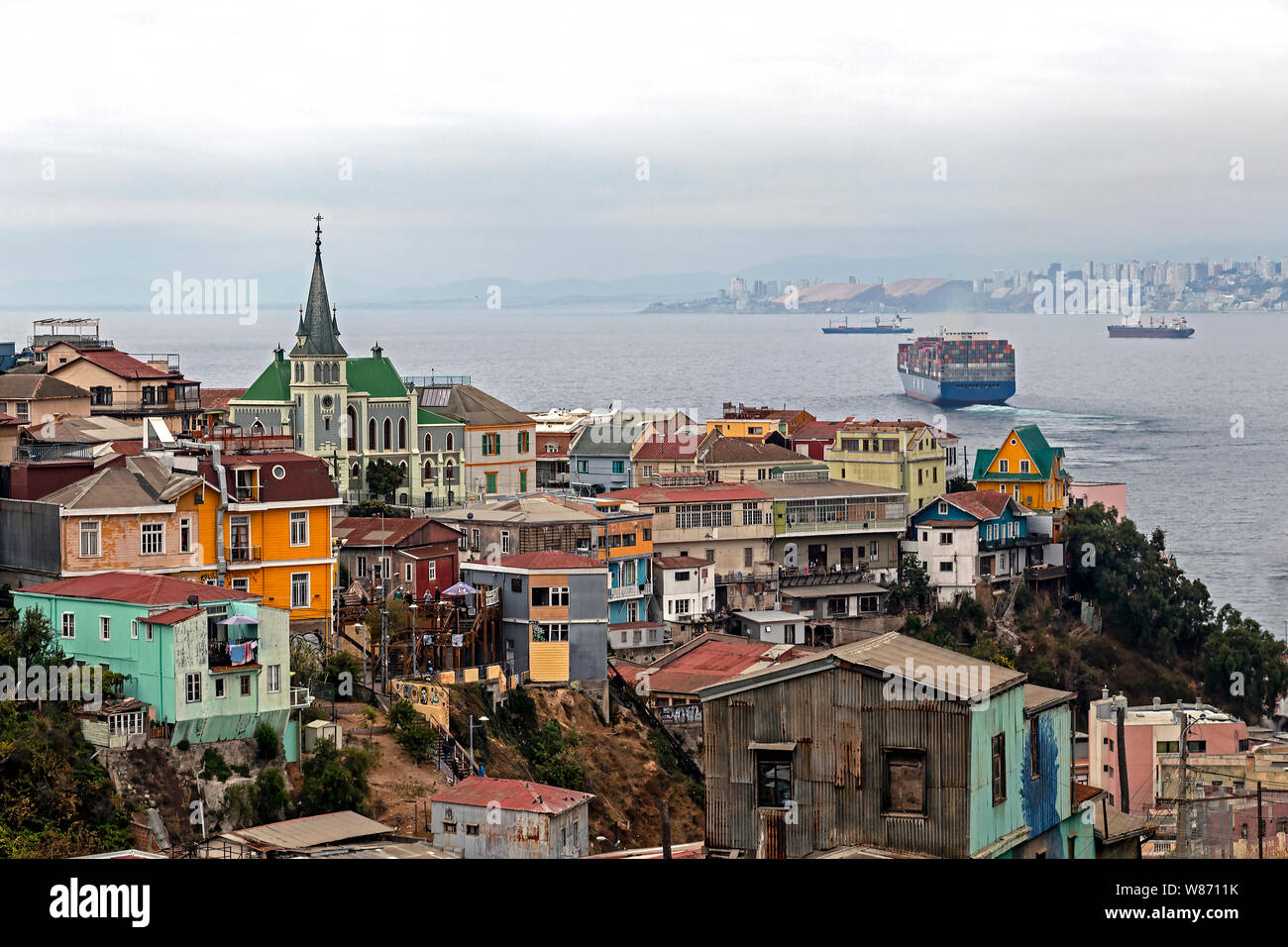 Valparaiso, Chile – April 3, 2019: Cityview with roofs and houses locates on the hillslopes, colourful architecture in Valparaiso poor suburb, Chile, Stock Photo