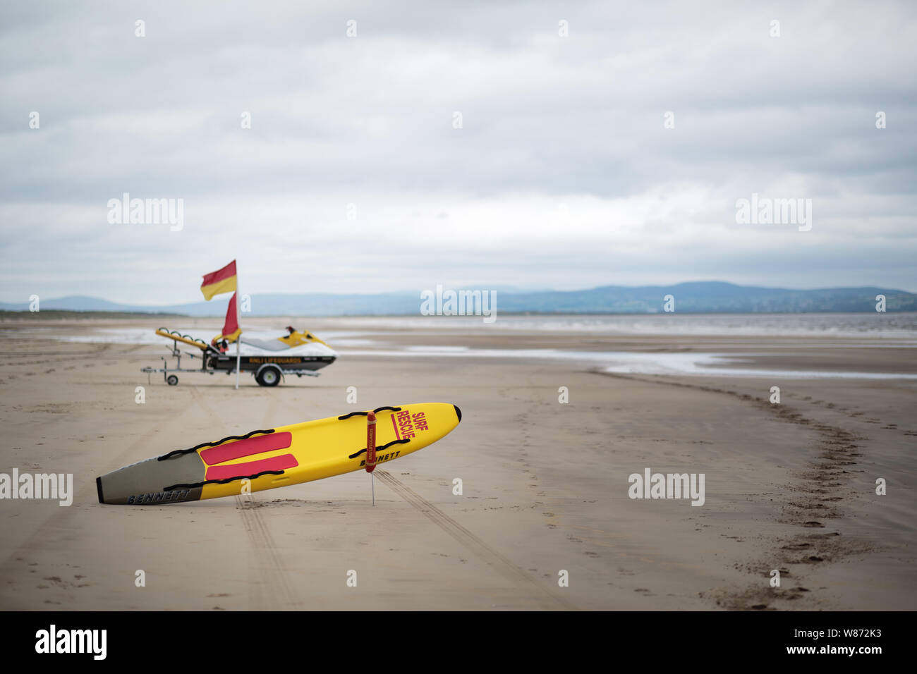 RNLI surfboard and jet ski on the beach  at Benone beach, Northern Ireland Stock Photo