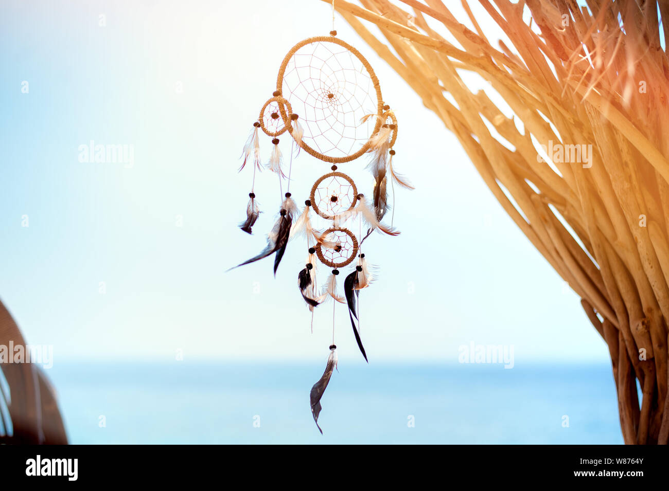 Dream catcher blown around by a light sea breeze Stock Photo - Alamy