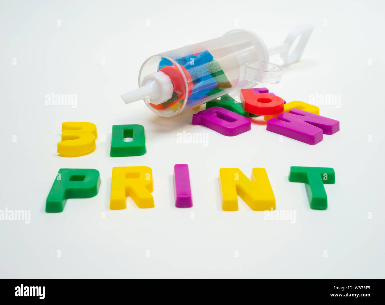 Syringe Lettering a plastic syringe full of plastic letters and numbers next to some ...