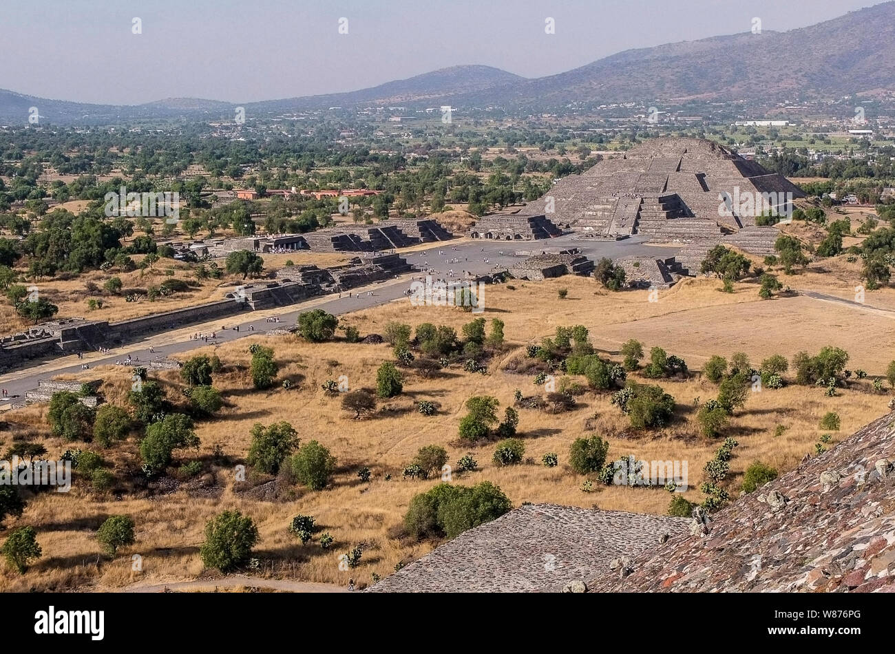 Teotihuacan, was a pre-Columbian Mesoamerican city located in the Basin of Mexico, 30 miles (48 km) northeast of modern day Mexico City, which is today known as the site of many of the most architecturally significant Mesoamerican pyramids built in the pre-Columbian Americas. Apart from the pyramids, Teotihuacan is also anthropologically significant for its complex, multi-family residential compounds, the Avenue of the Dead, and the small portion of its vibrant murals that have been exceptionally well-preserved. Additionally, Teotihuacan produced a thin orange pottery style that spread through Stock Photo