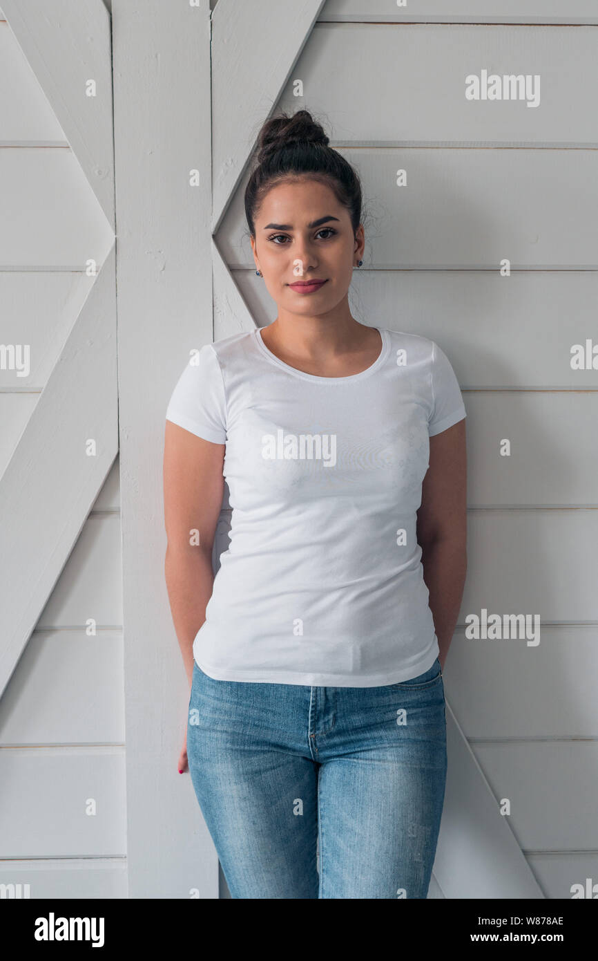 A beautiful girl in a white t-shirt. Layout for the design of everyday youth clothing Stock Photo