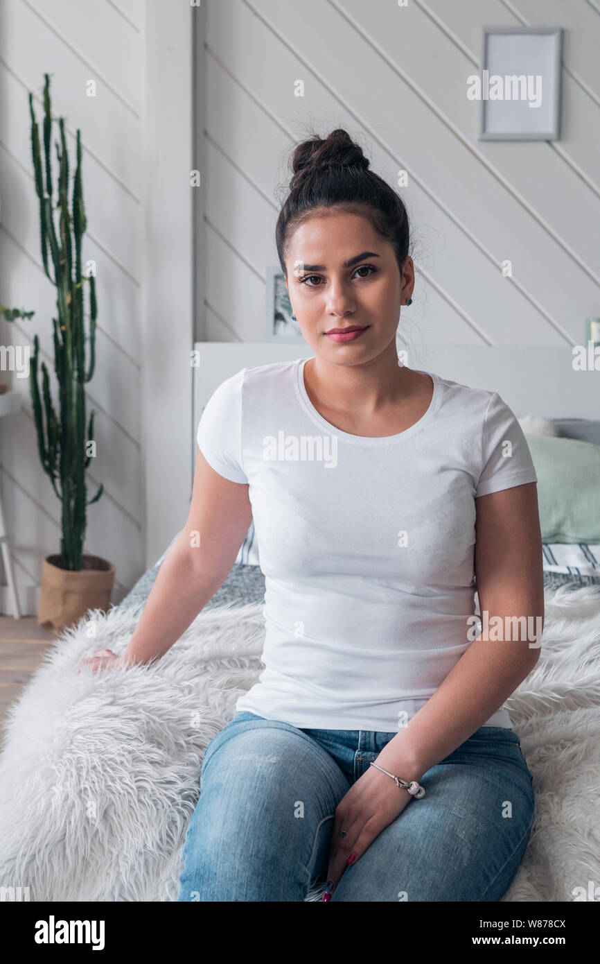 Portrait of a young beautiful girl in a white t-shirt. Casual style Stock Photo