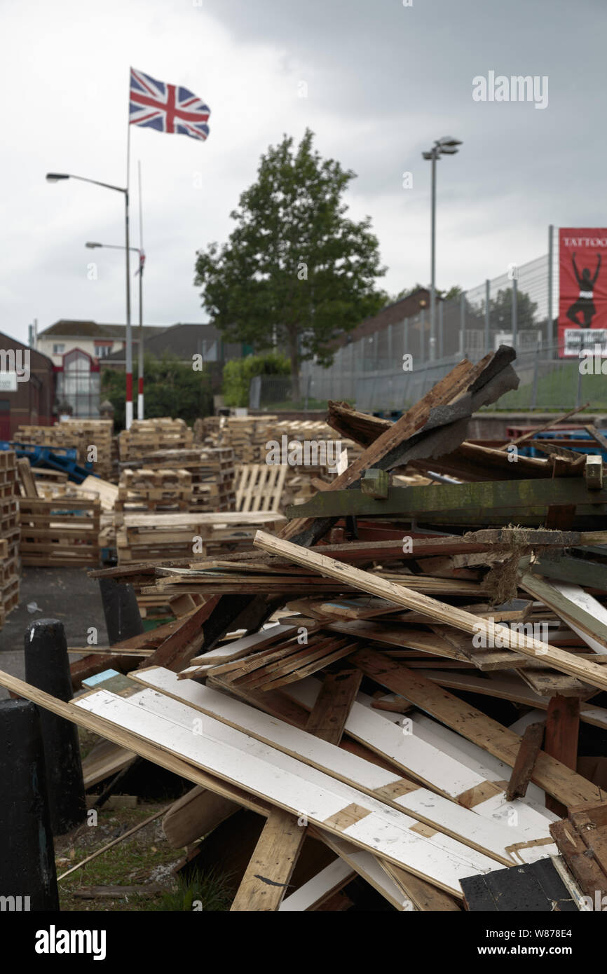 Pallets placed along the street in readiness for the July fire marking the annual Orange Parades, The Fountain Estate, Derry / Londonderry Stock Photo