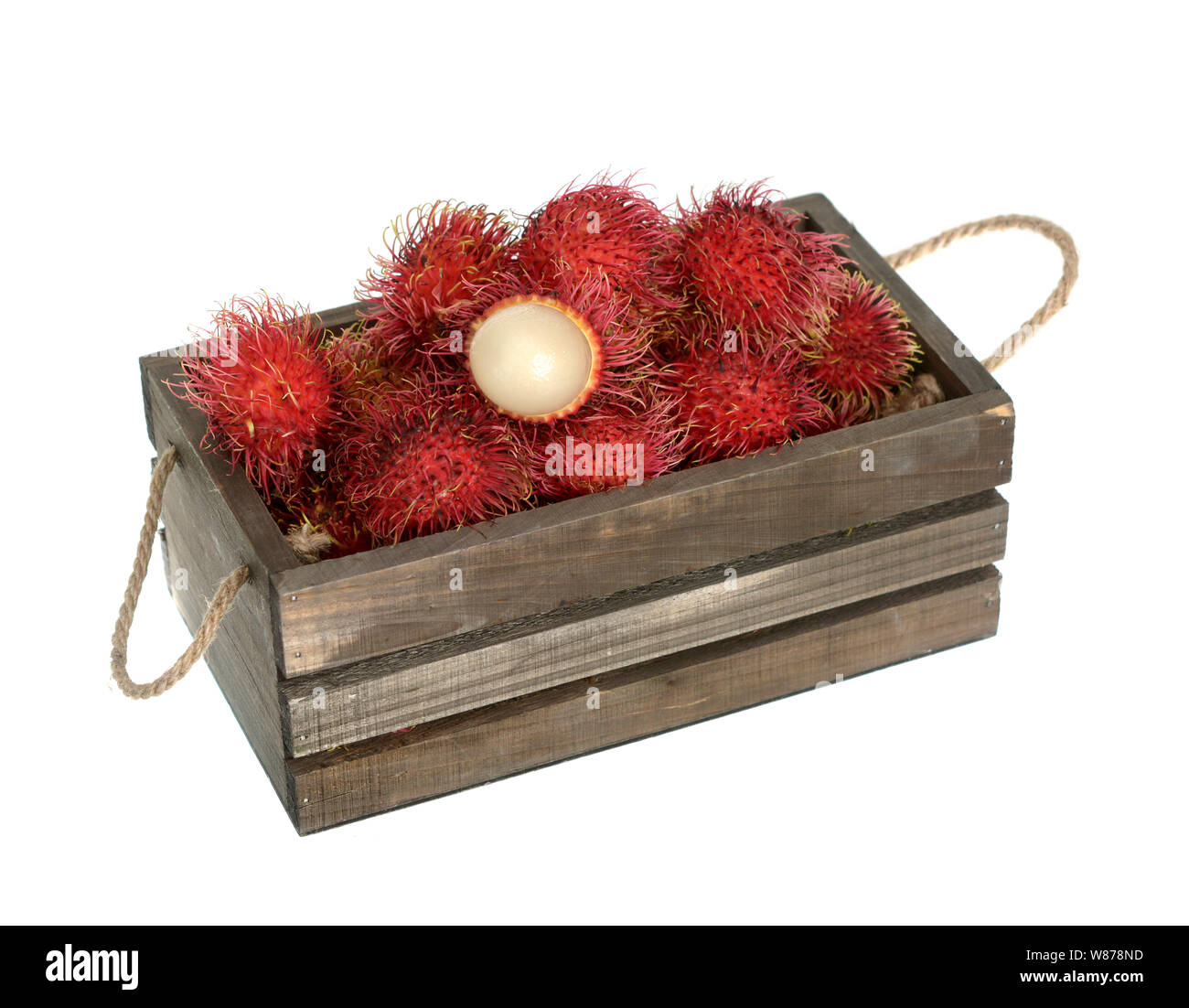 Rambutan in wooden bucket isolated on white Stock Photo - Alamy