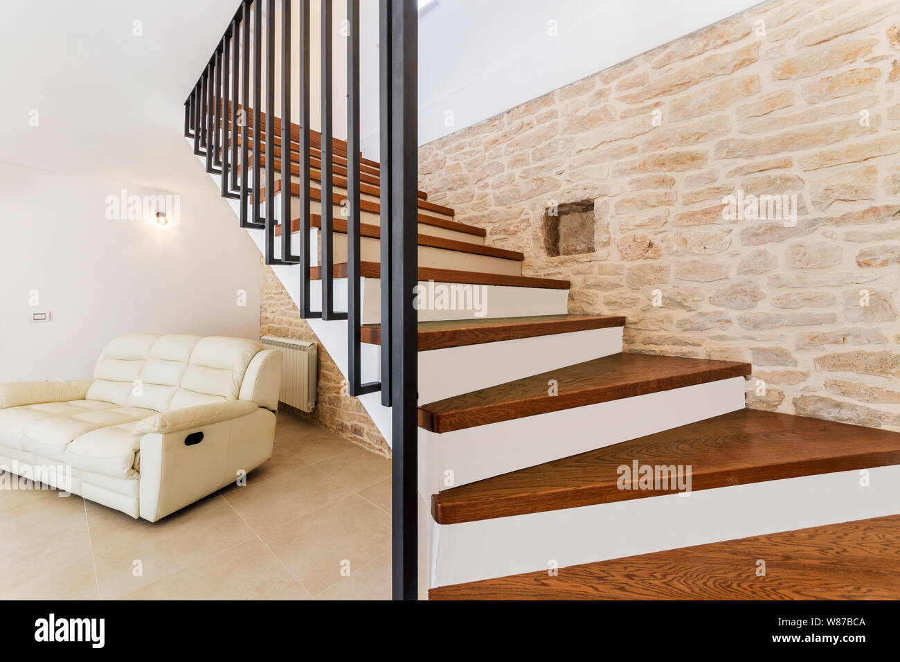 living room interior with wooden stairway Stock Photo
