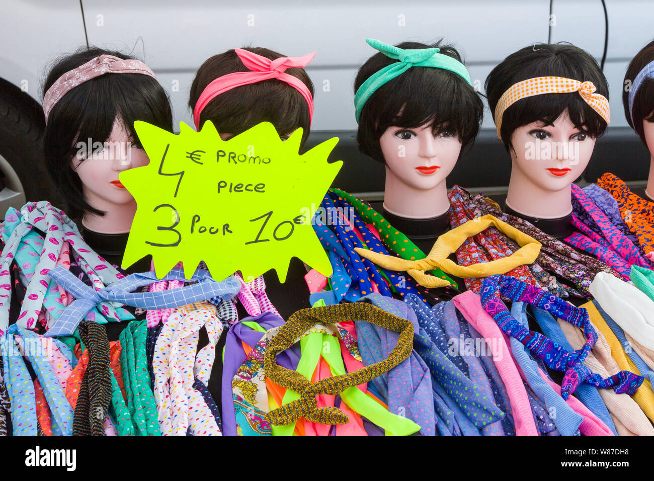 Colourful hairbands for sale on a stall in hte Saturday market in Honfleur, Normandy, France Stock Photo