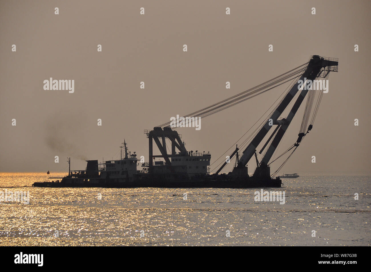 a crane barge used in shipbuilding on the Yangtse river in Nantong, China Stock Photo