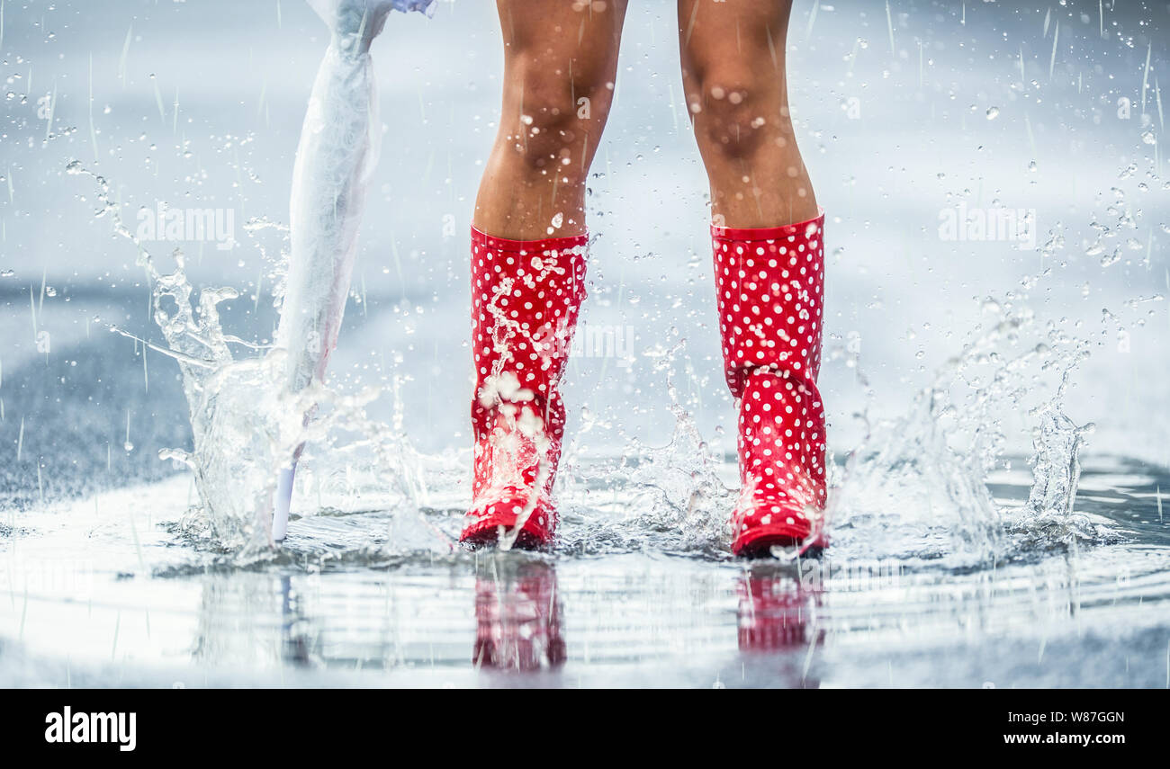 Jump in puddles woman hires stock photography and images Alamy