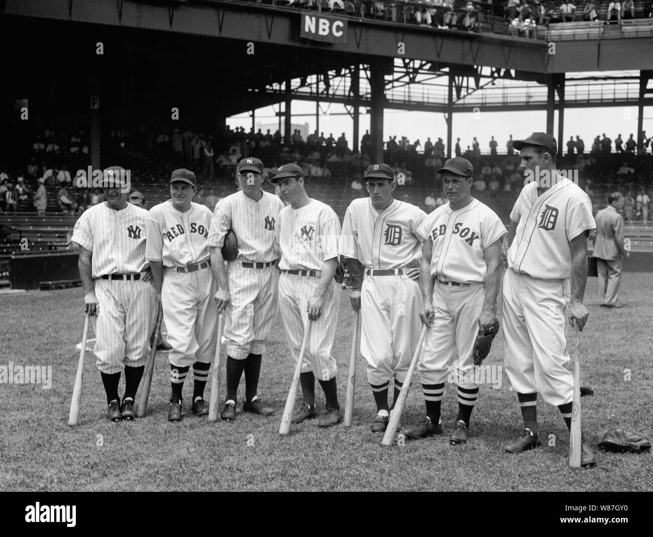 Original title: Plenty of basehits in these bats  Original description: Washington D.C., July 7. A million dollar base-ball flesh is represented in these sluggers of the two All- Star Teams which met in the 1937 game at Griffith Stadium today. Left to right: Lou Gehrig, Joe Cronin, Bill Dickey, Joe DiMaggio, Charlie Gehringer, Jimmie Foxx, and Hank Greenberg, 7/7/37 Stock Photo