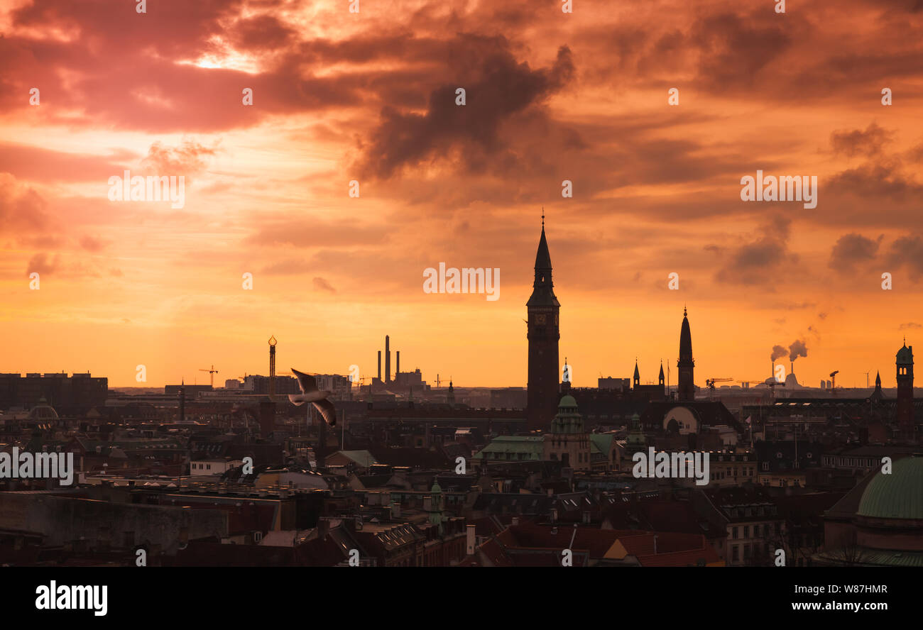 Dark silhouette skyline of Copenhagen city under colorful evening sky. Photo taken from The Round Tower, popular old city landmark and viewpoint. Denm Stock Photo