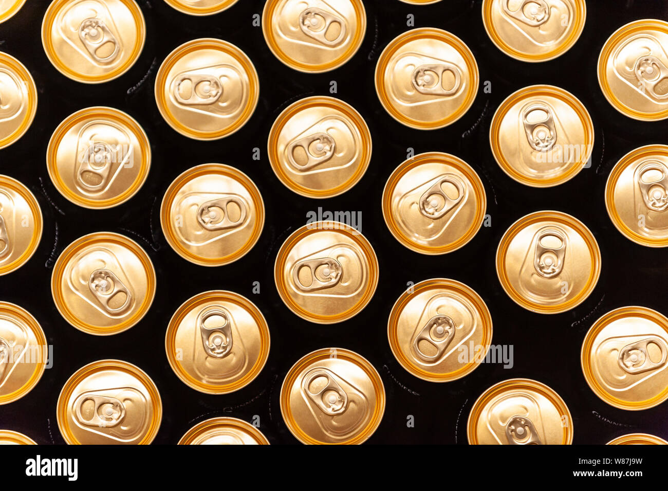Rows of beer cans in a brewery canning plant, pictured from directly