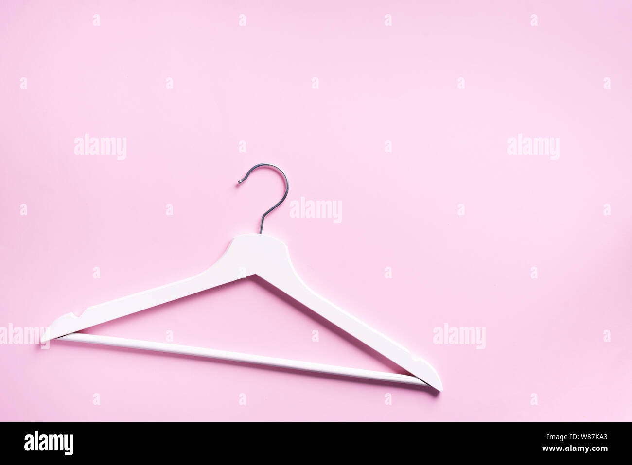 Top view of white clothes hangers on pink background with copy space. Flat  lay. Minimalism style. Creative layout. Fashion, store sale, shopping conce  Stock Photo - Alamy