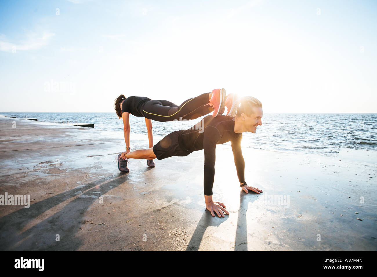 Young couple working out outdoors Stock Photo