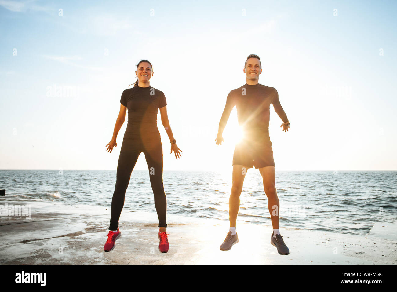 Young couple working out outdoors Stock Photo