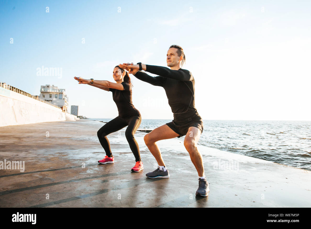 Young couple working out outdoors Stock Photo