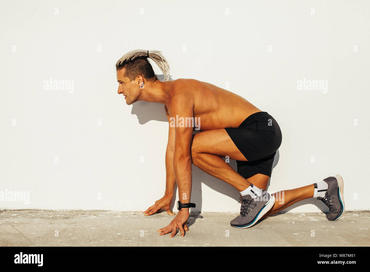 Fit man getting ready for the  running Stock Photo