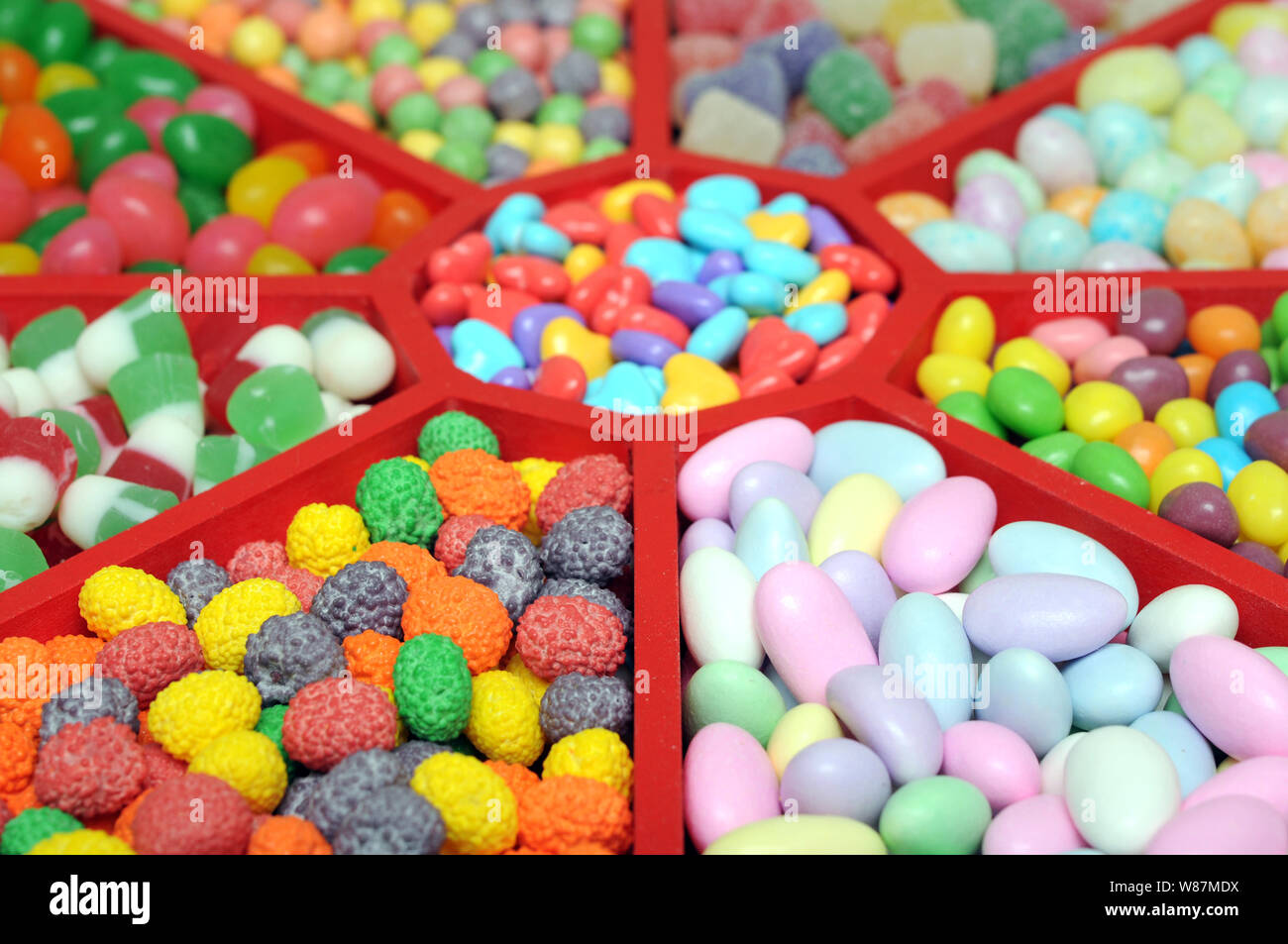 Colorful candy in wooden tray Stock Photo - Alamy