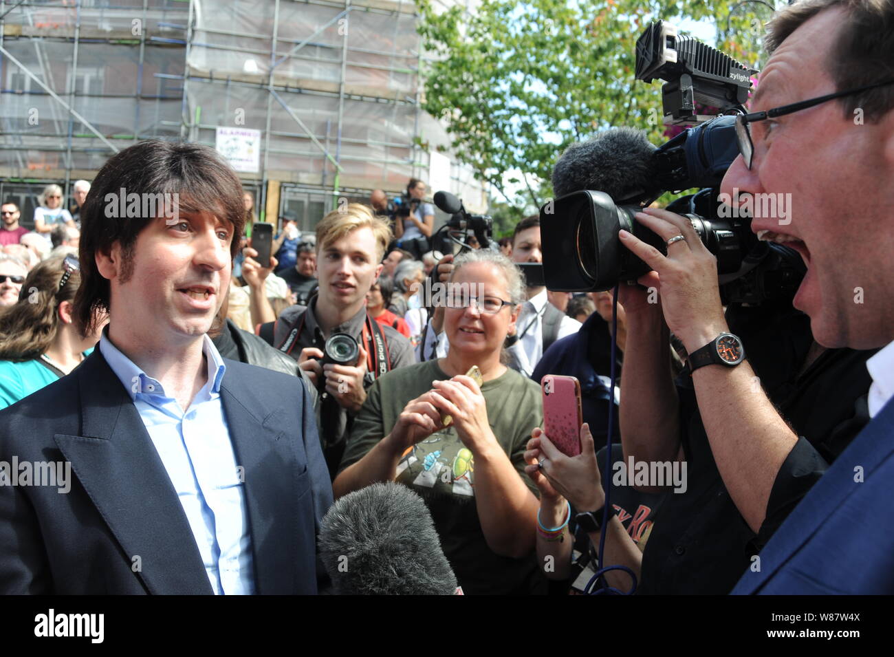Crossing at Abbey Road, NW8, London, UK. 8th August, 2019. The Beatles tribute band arrive at the infamous Abbey Road crossing to celebrate the 50th anniversary of The Beatles album Abbey Road. Credit: David Bronstein/ Alamy Live News Stock Photo